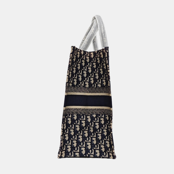 Authenticated pre-owned  Book Tote Large Monogram Canvas Beige - Tote Bag at Looply