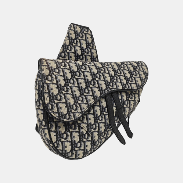 Authenticated pre-owned  Saddle Medium Monogram Canvas Beige - Crossbody Bag at Looply