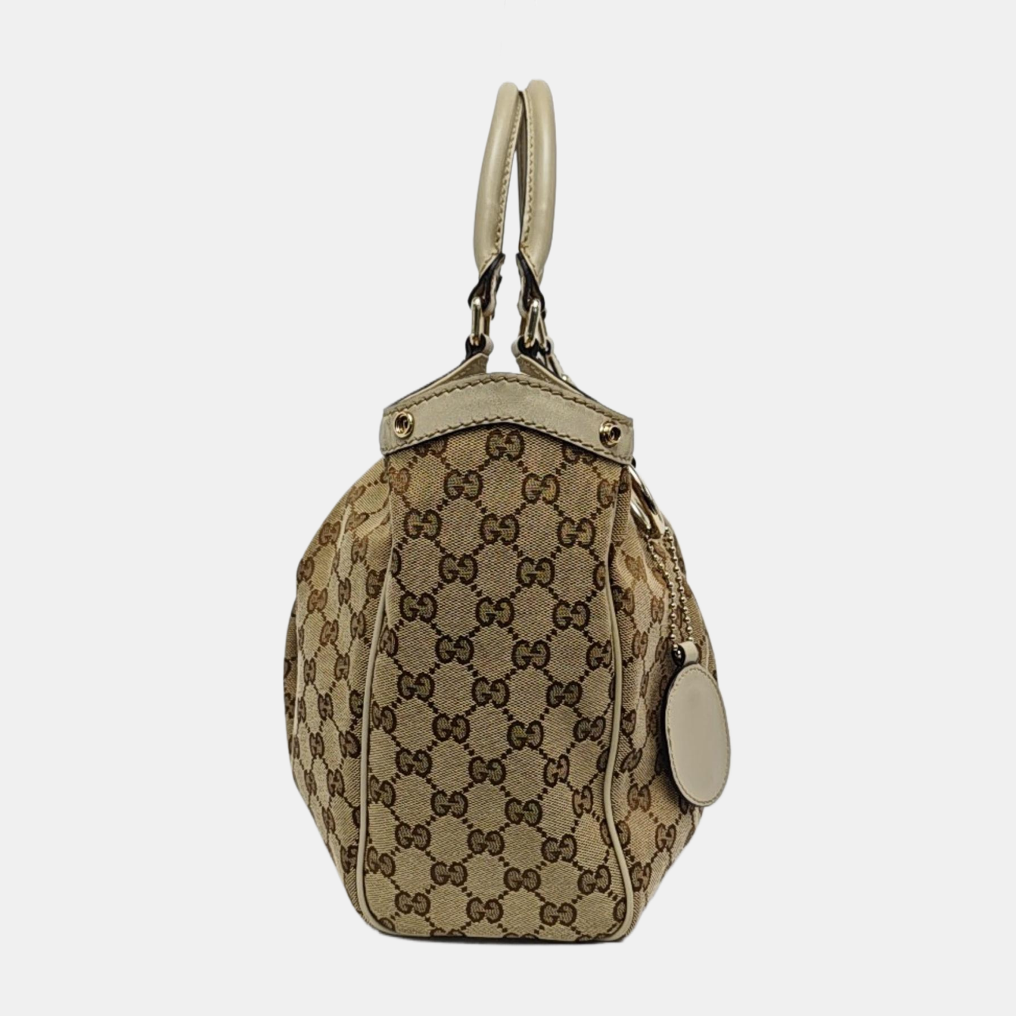 Authenticated pre-owned  Sukey Monogram Canvas Beige - Top Handle Bag at Looply