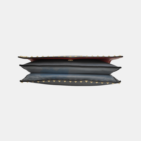 Authenticated pre-owned  Rockstud Calfskin Blue - Clutch at Looply