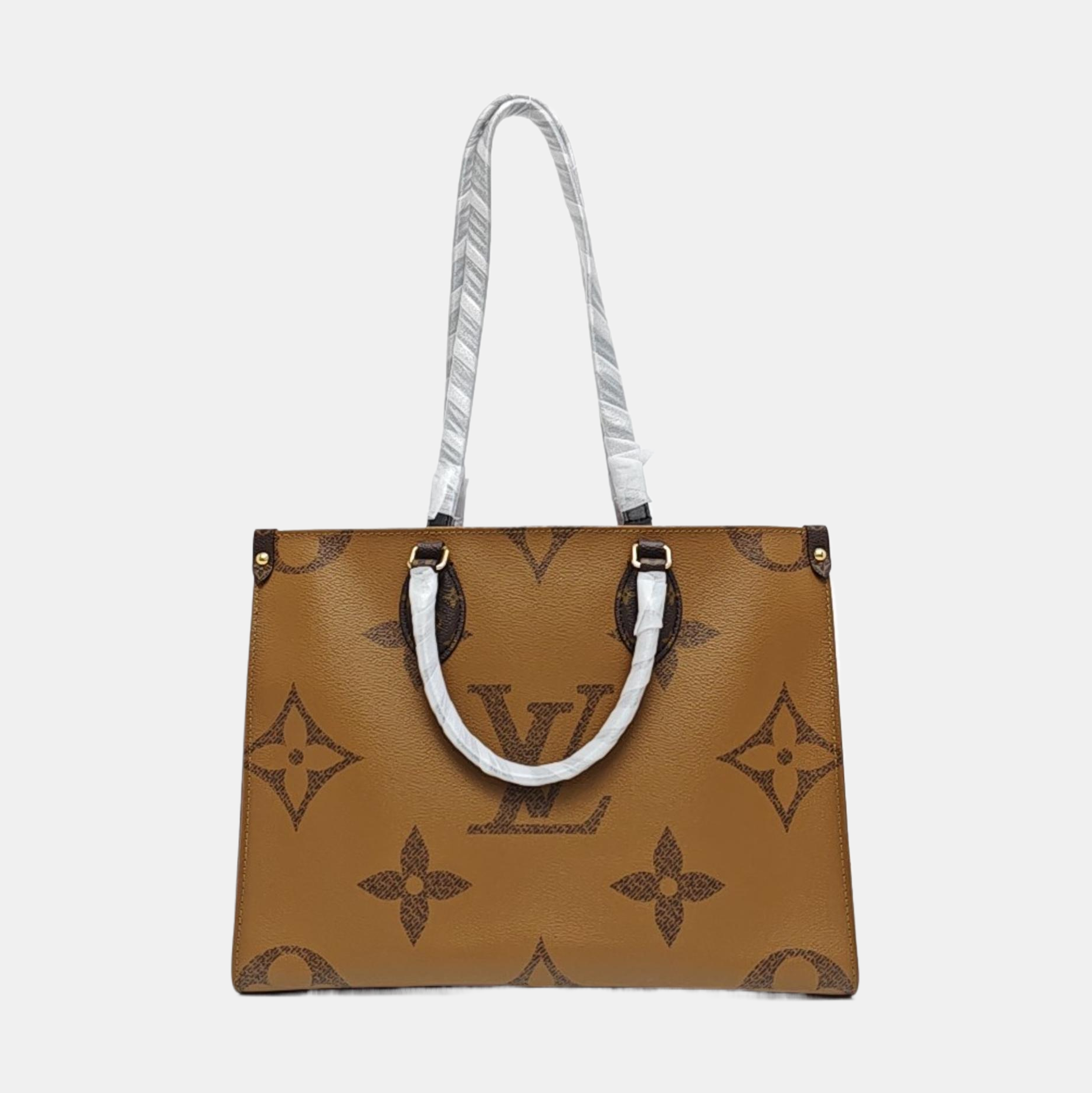 ONTHEGO MM Monogram Coated Canvas Brown