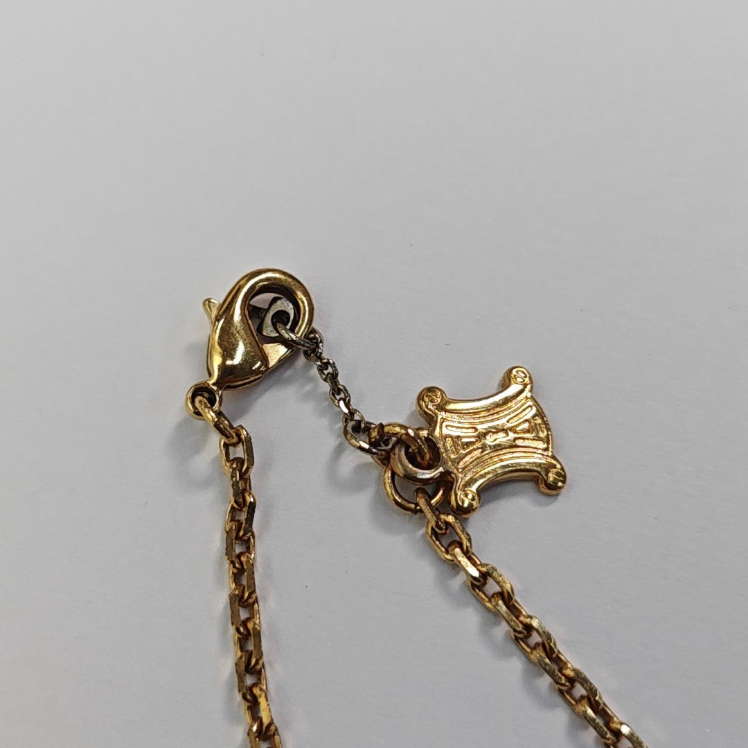 Collar de metal dorado