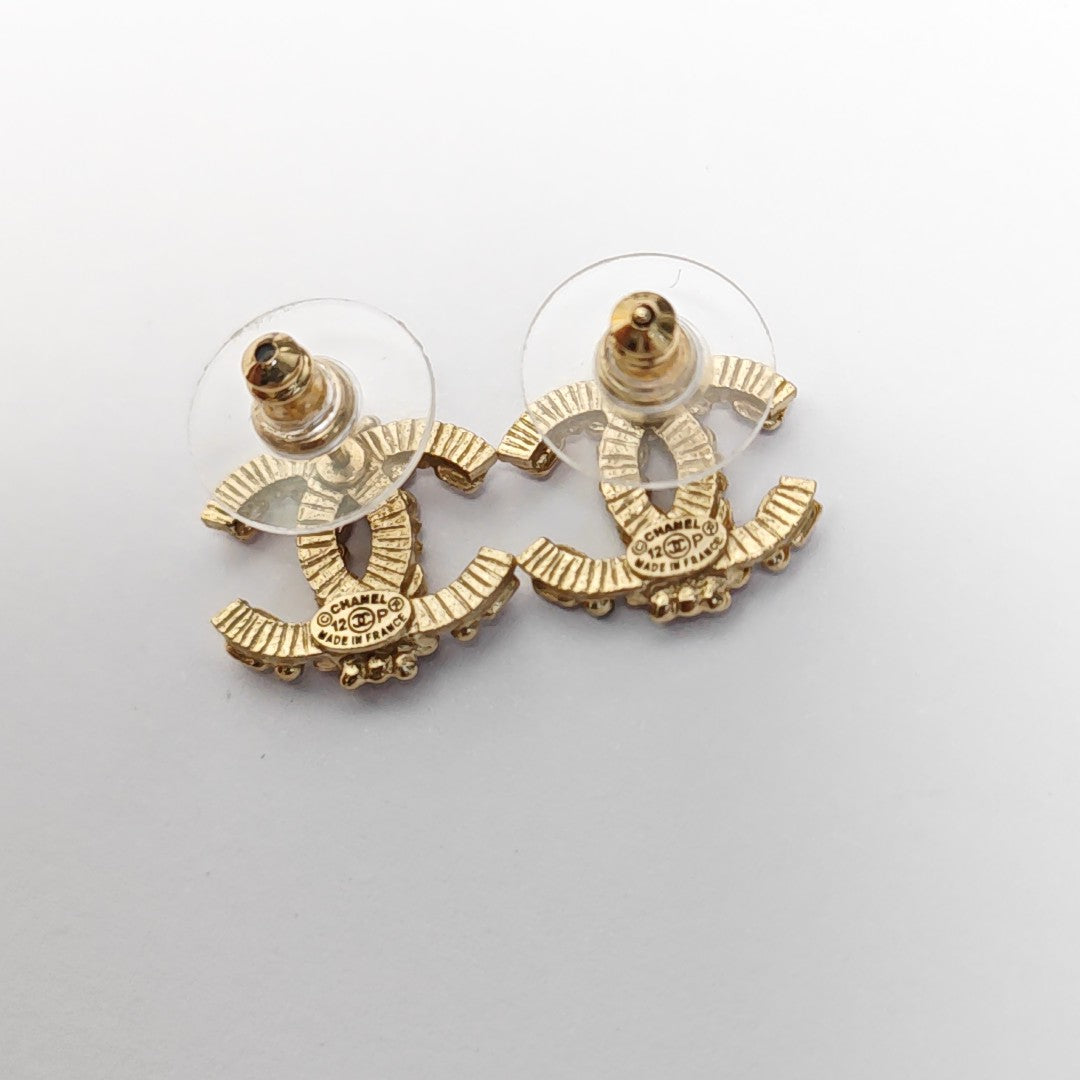 Pendientes CC en tono dorado, metal, otros dorados