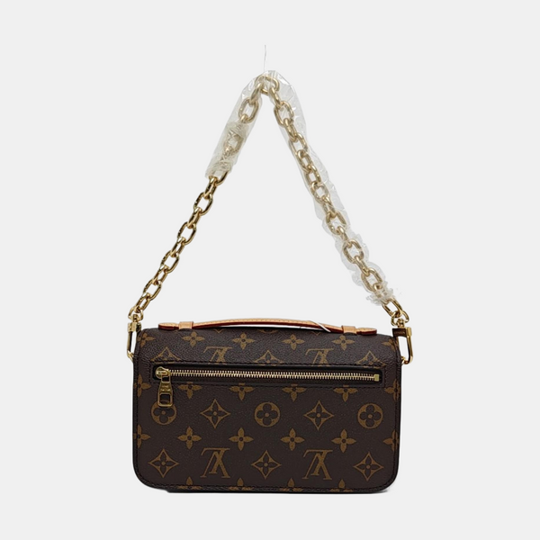 MÉTIS EAST WEST Monogram Coated Canvas Brown