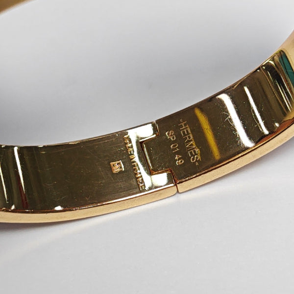 Brazalete Clic H de metal dorado