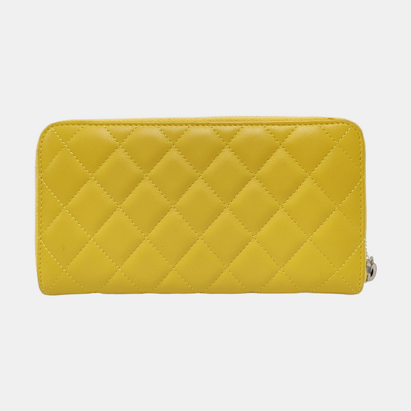 Authenticated pre-owned  WOC Quilted Lambskin Yellow Wallet - Wallet at Looply