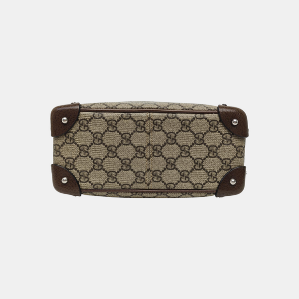 Trunk Monogram Coated Canvas Brown