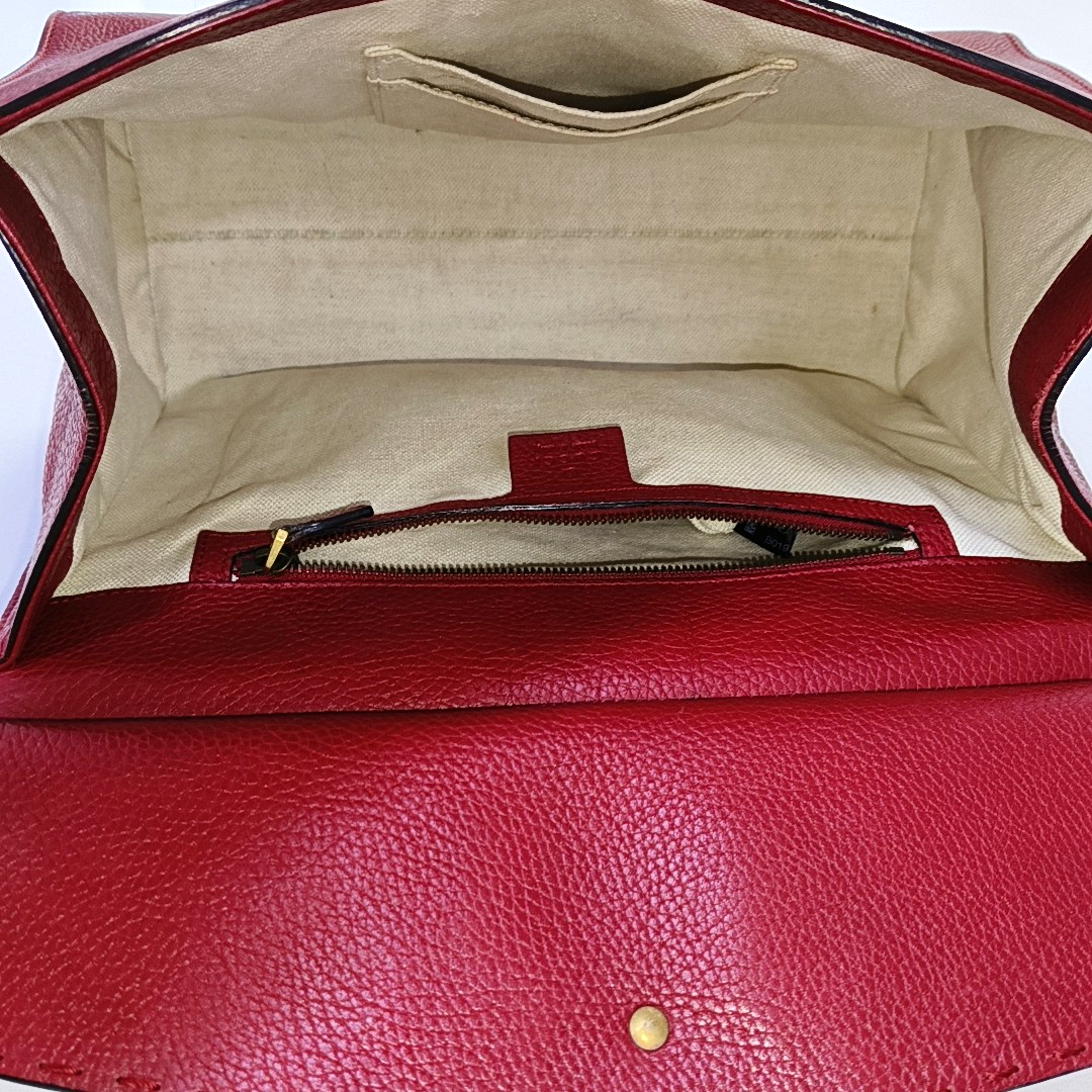 Authenticated pre-owned  GG Marmont Top Handle Small Calfskin Red - Shoulder Bag at Looply