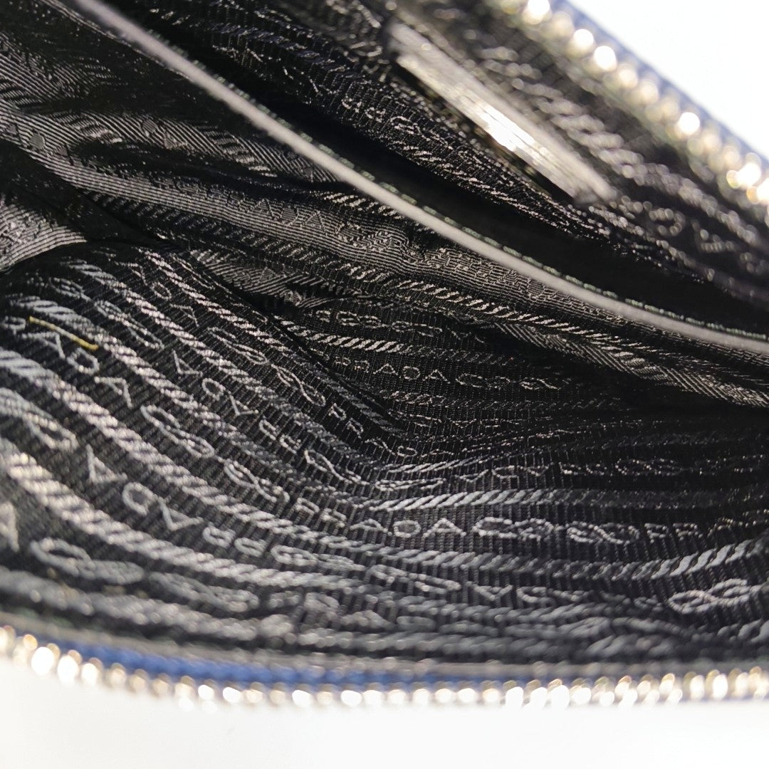 Authenticated pre-owned  Triangle Calfskin Blue - Crossbody Bag at Looply