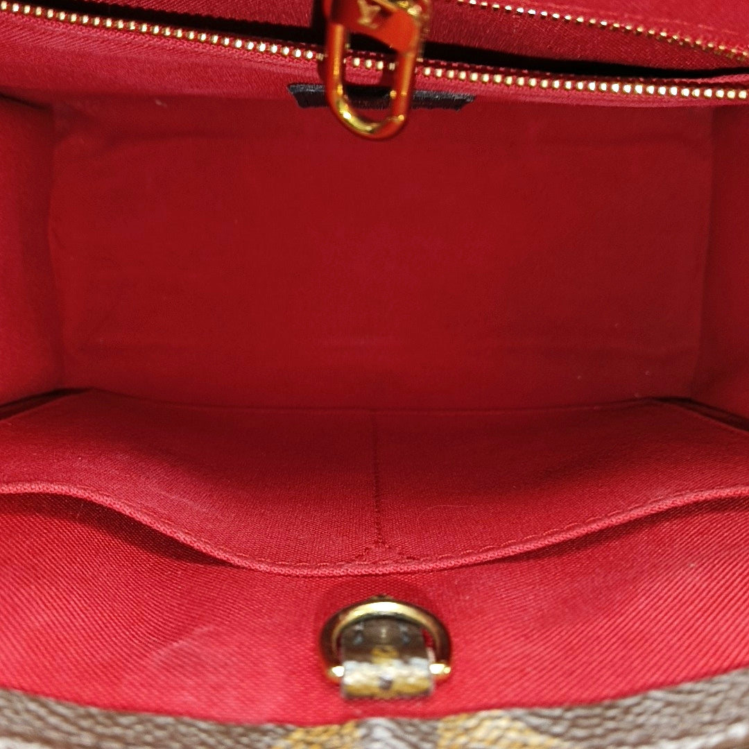 ONTHEGO PM Monogram Coated Canvas Brown