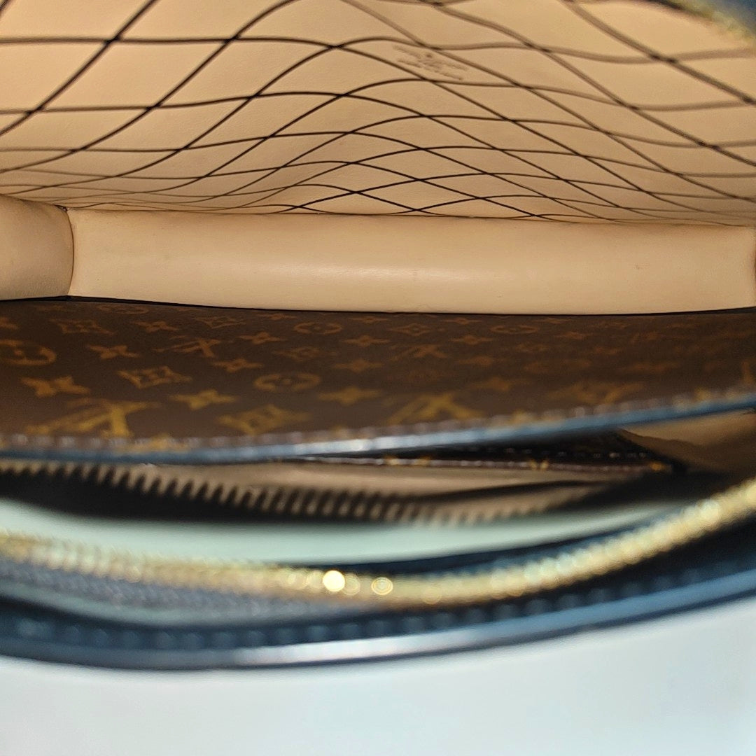 TRUNK Monogram Coated Canvas Brown