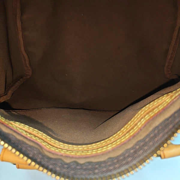 SPEEDY 25 Monogram Coated Canvas Brown