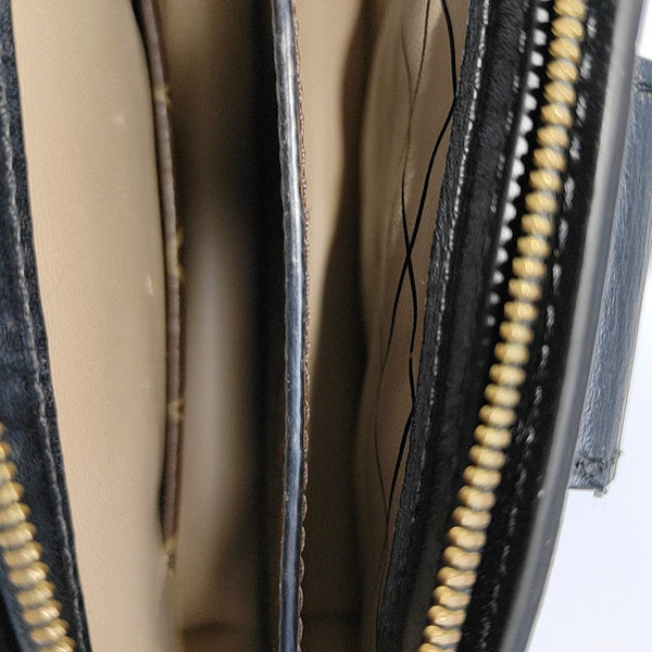 TRUNK Monogram Coated Canvas Brown