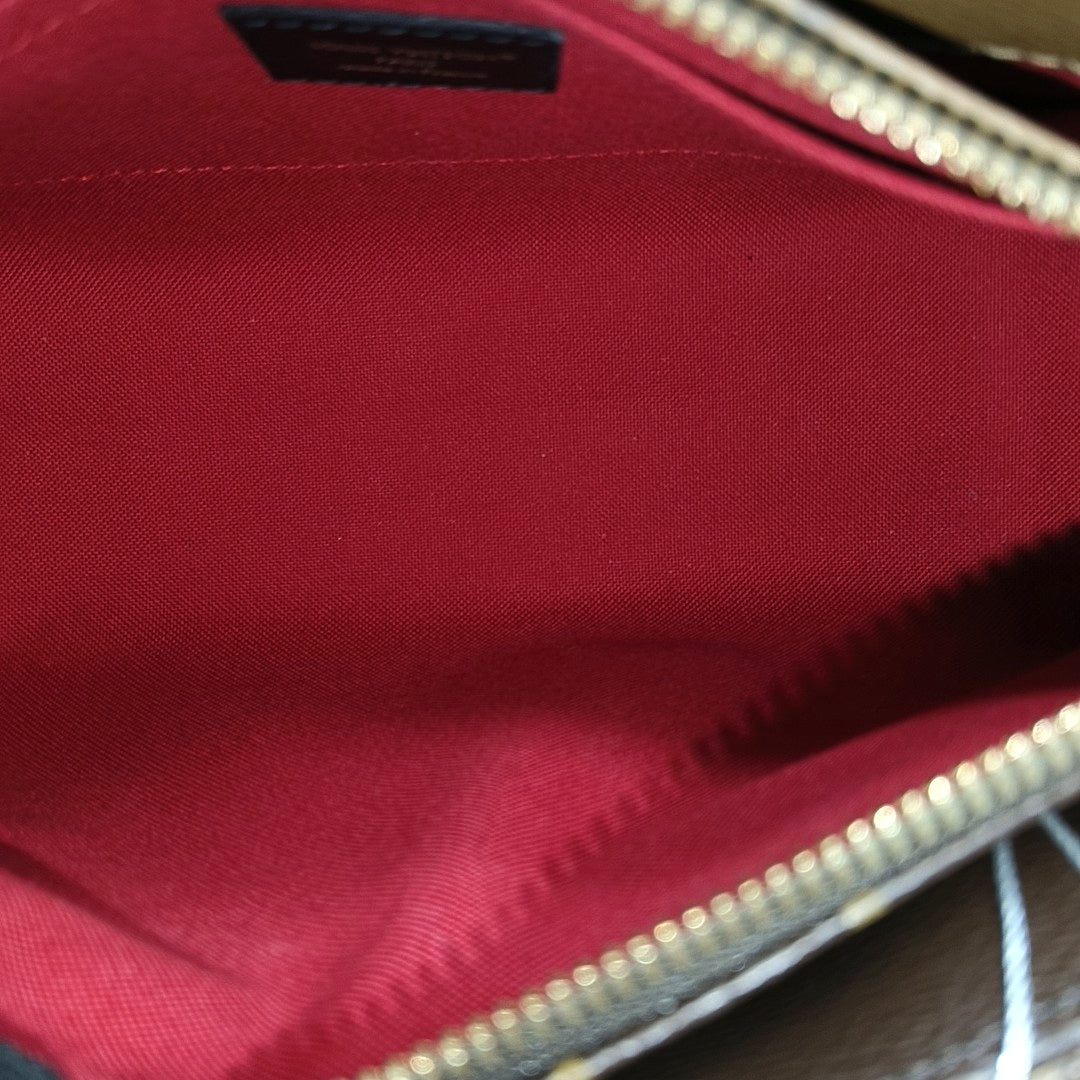 ONTHEGO EAST WEST PM Monogram Coated Canvas Brown
