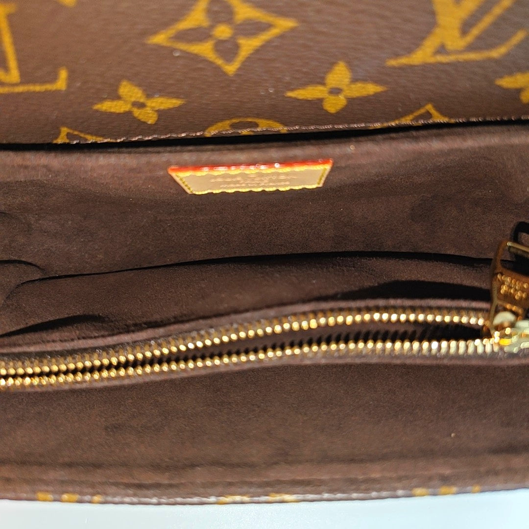 MÉTIS EAST WEST Monogram Coated Canvas Brown