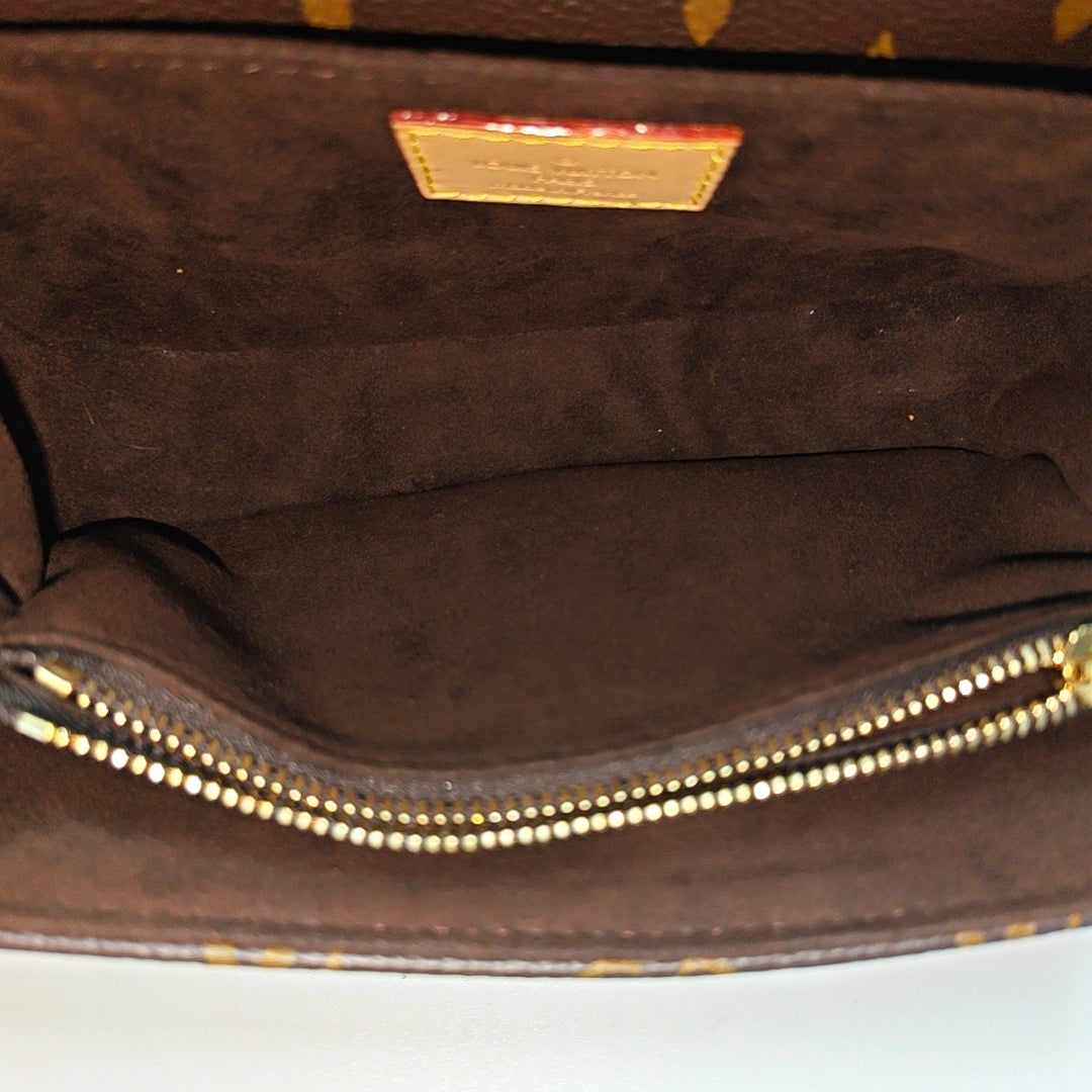 MÉTIS EAST WEST Monogram Coated Canvas Brown