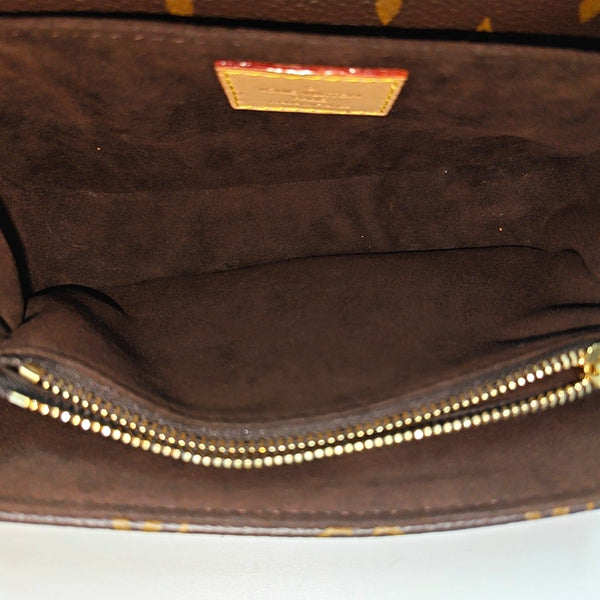 MÉTIS EAST WEST Monogram Coated Canvas Brown