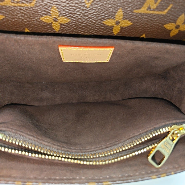 MÉTIS EAST WEST Monogram Coated Canvas Brown