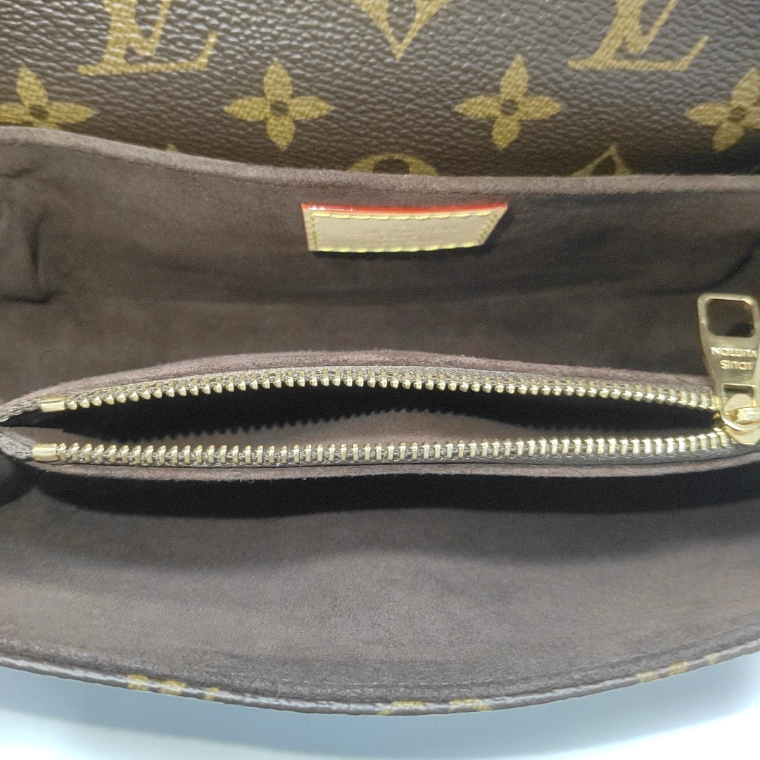 MÉTIS EAST WEST Monogram Coated Canvas Brown