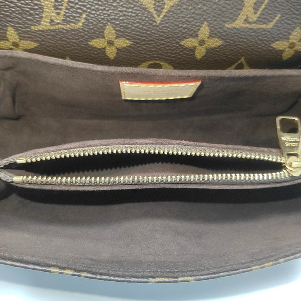 MÉTIS EAST WEST Monogram Coated Canvas Brown