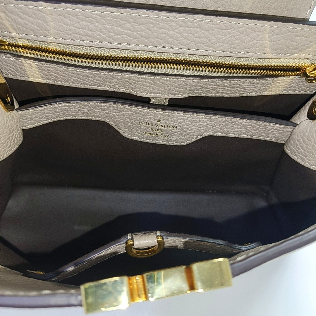 Authenticated pre-owned  CAPUCINES BB Calfskin Grey - Shoulder Bag at Looply