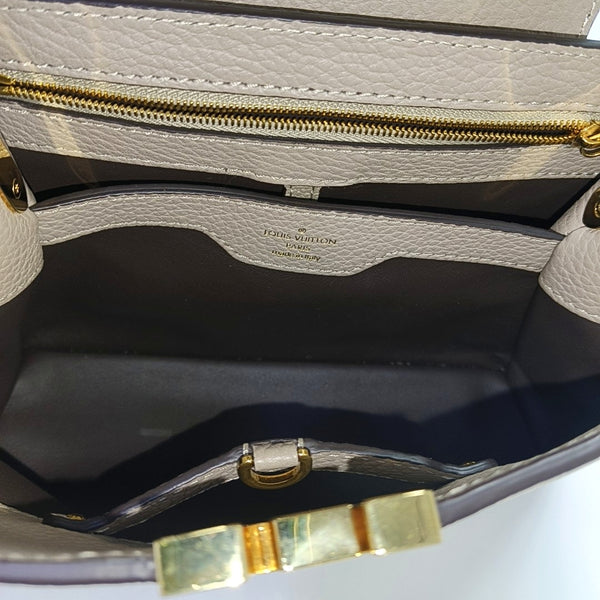 Authenticated pre-owned  CAPUCINES BB Calfskin Grey - Shoulder Bag at Looply