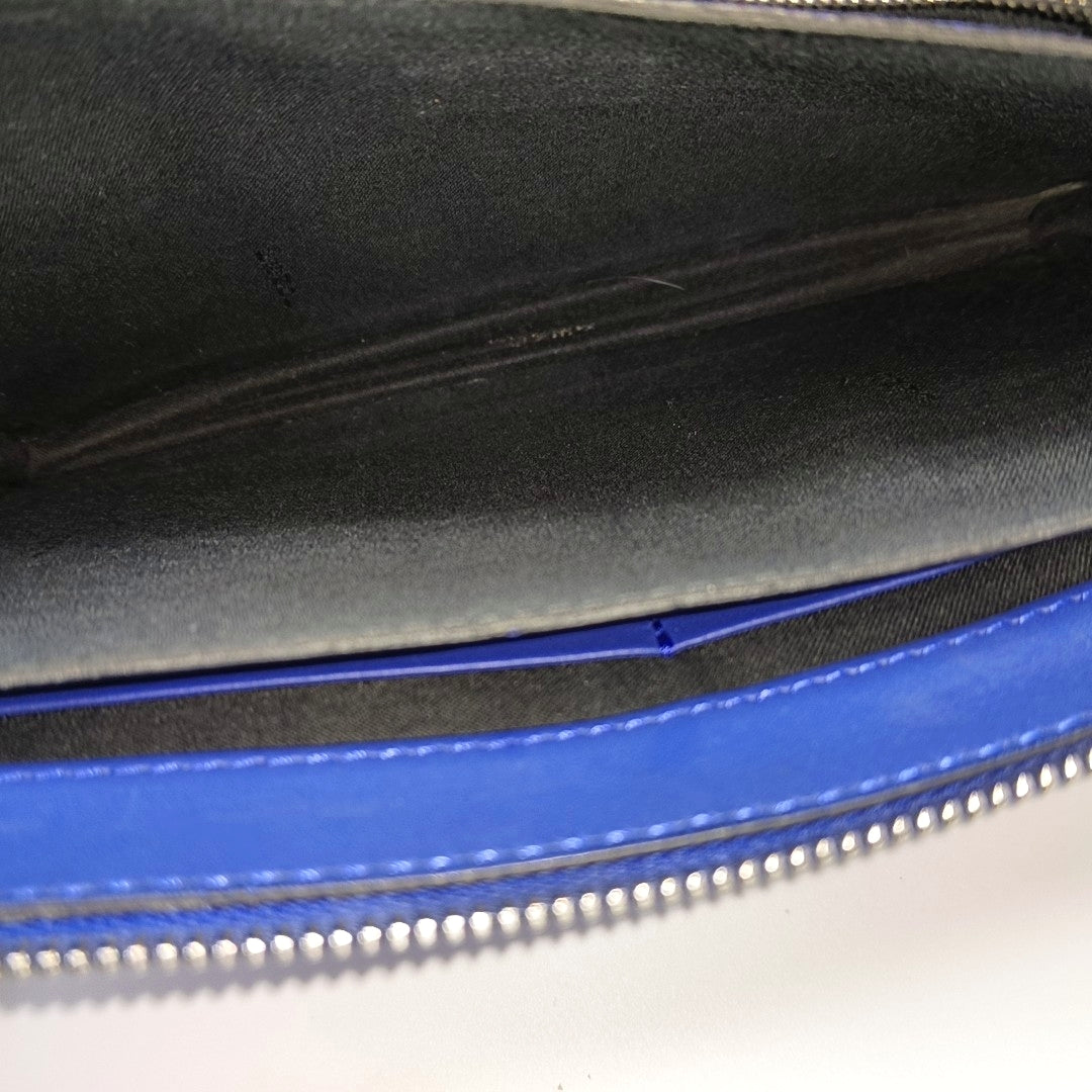 Authenticated pre-owned  Monster Calfskin Blue - Clutch at Looply