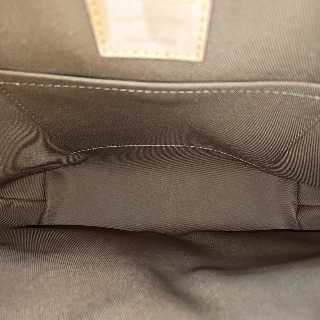 EXCURSION PM Monogram Coated Canvas Brown