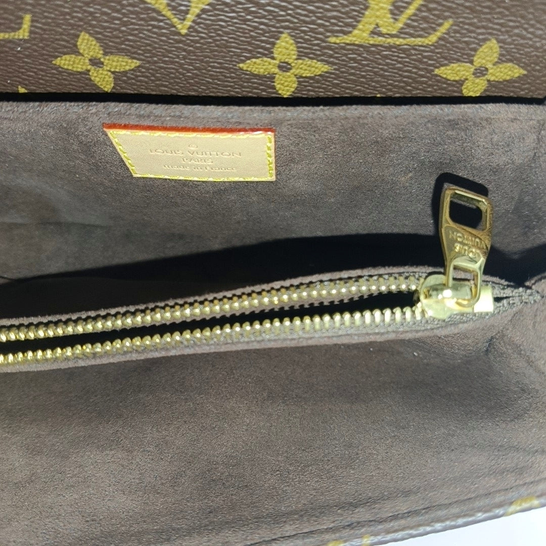 MÉTIS EAST WEST Monogram Coated Canvas Brown