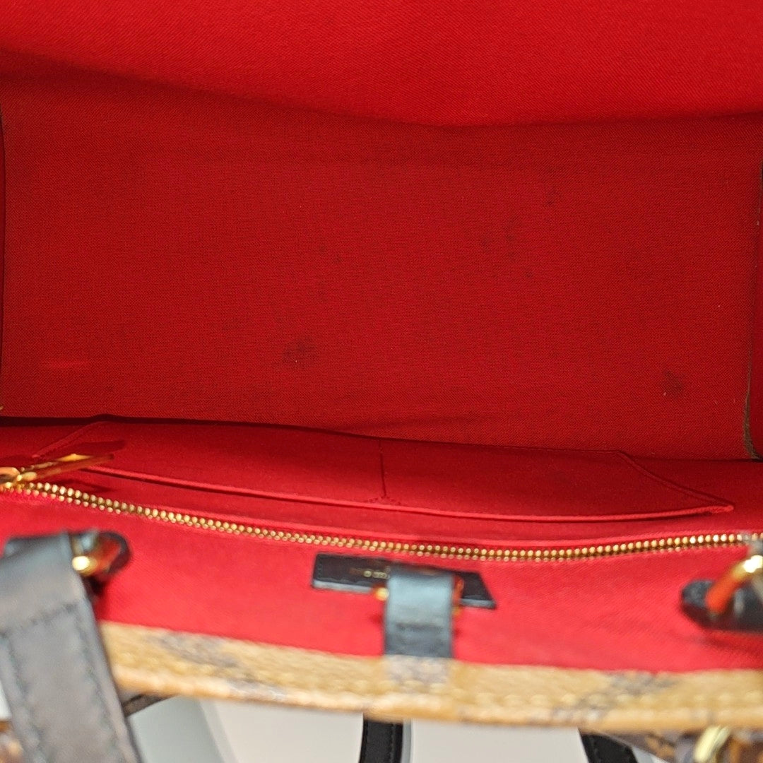 ONTHEGO MM Monogram Coated Canvas Brown