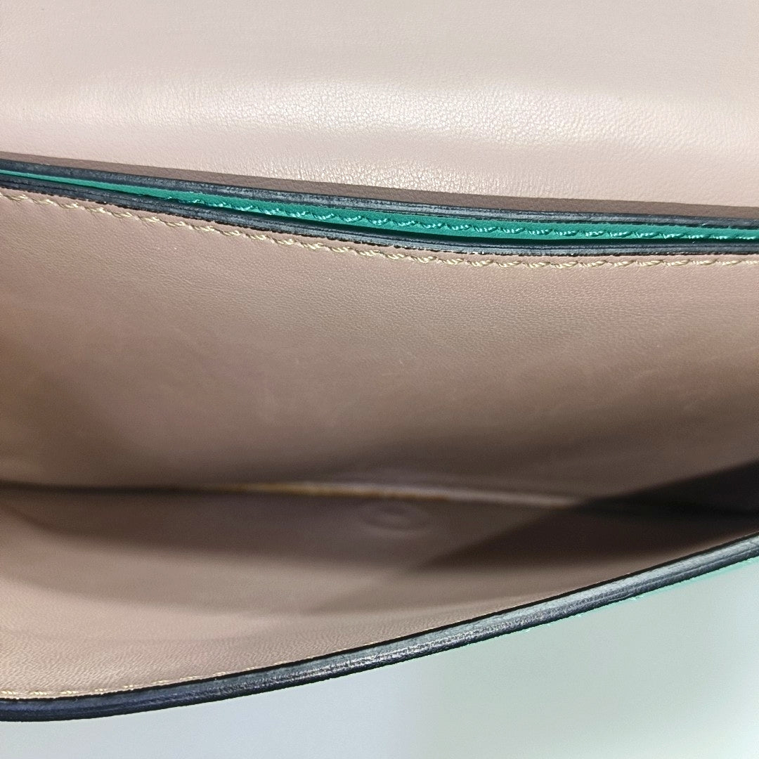 Authenticated pre-owned  Rockstud Lambskin Green - Clutch at Looply