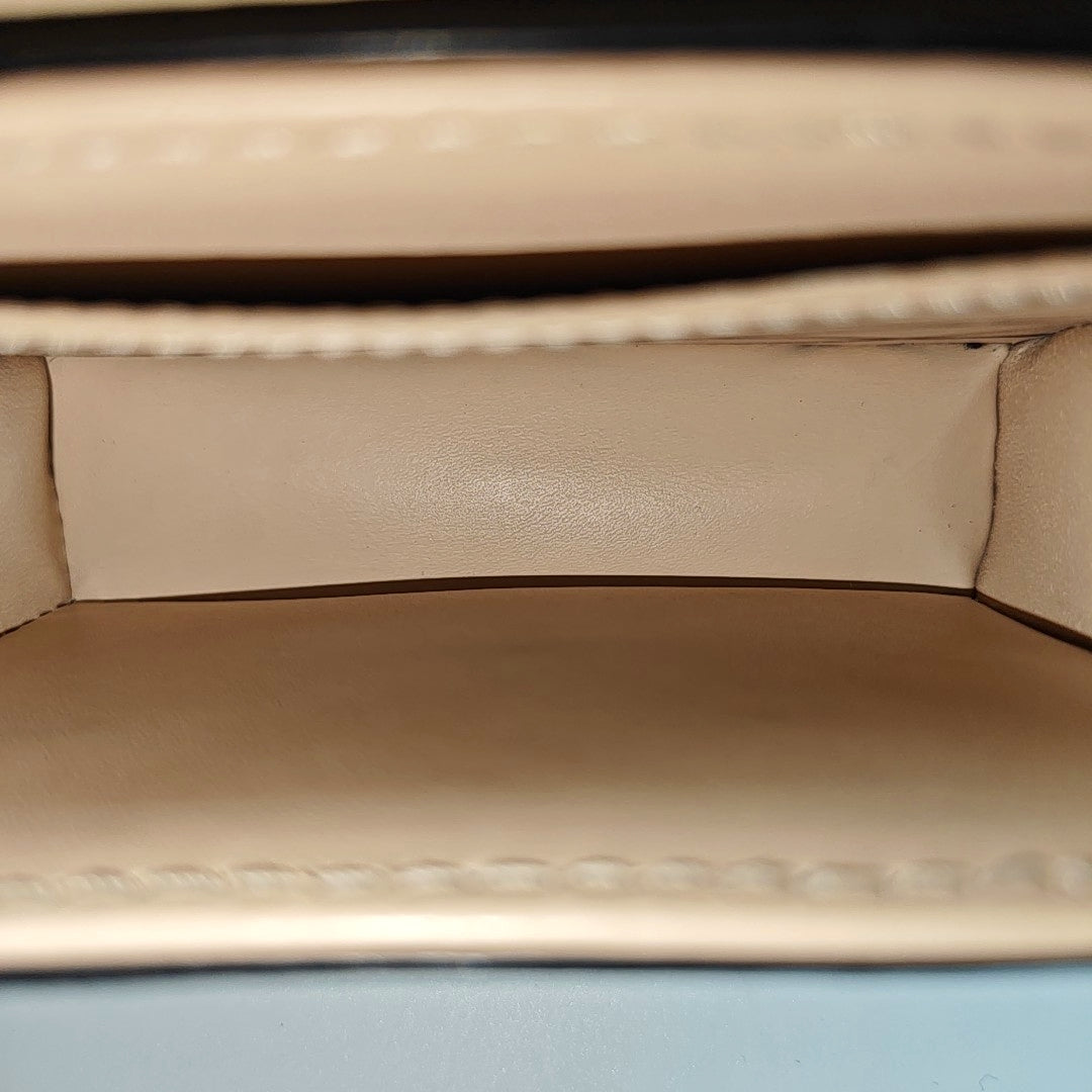TRUNK Monogram Coated Canvas Brown
