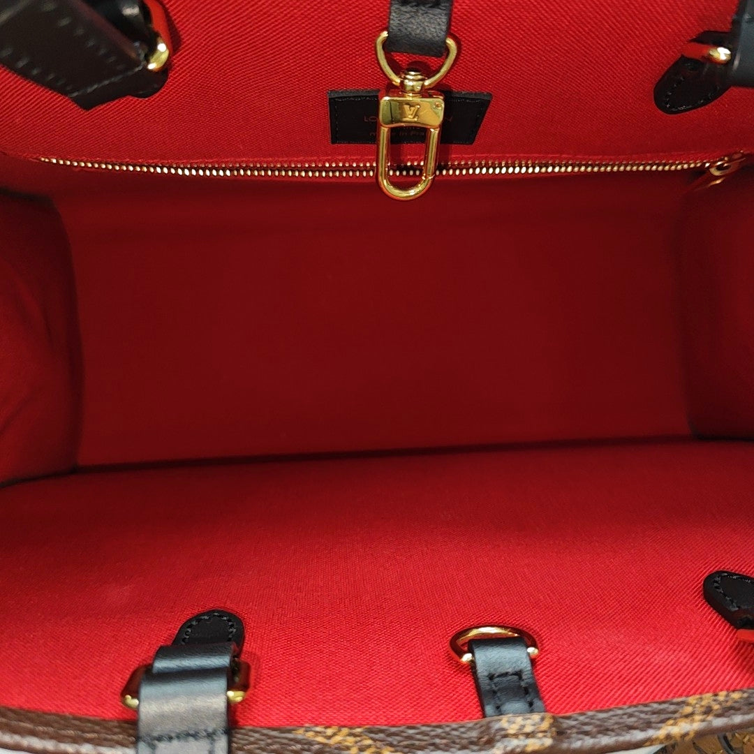 ONTHEGO MM Monogram Coated Canvas Brown