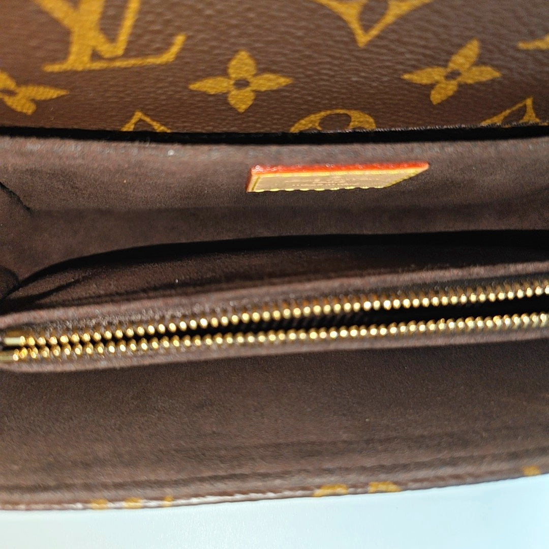 MÉTIS EAST WEST Monogram Coated Canvas Brown