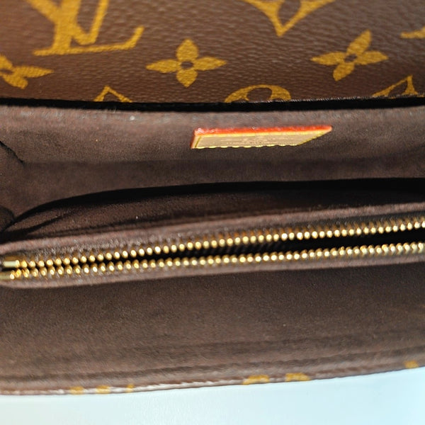 MÉTIS EAST WEST Monogram Coated Canvas Brown