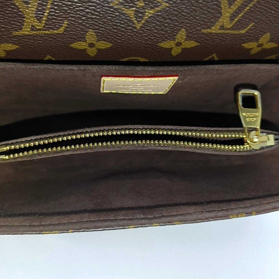 MÉTIS EAST WEST Monogram Coated Canvas Brown