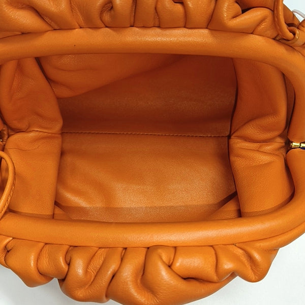 Authenticated pre-owned  The Pouch Mini Calfskin Orange - Crossbody Bag at Looply