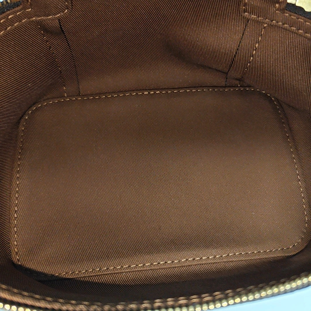 Monogram Coated Canvas Clutch Brown