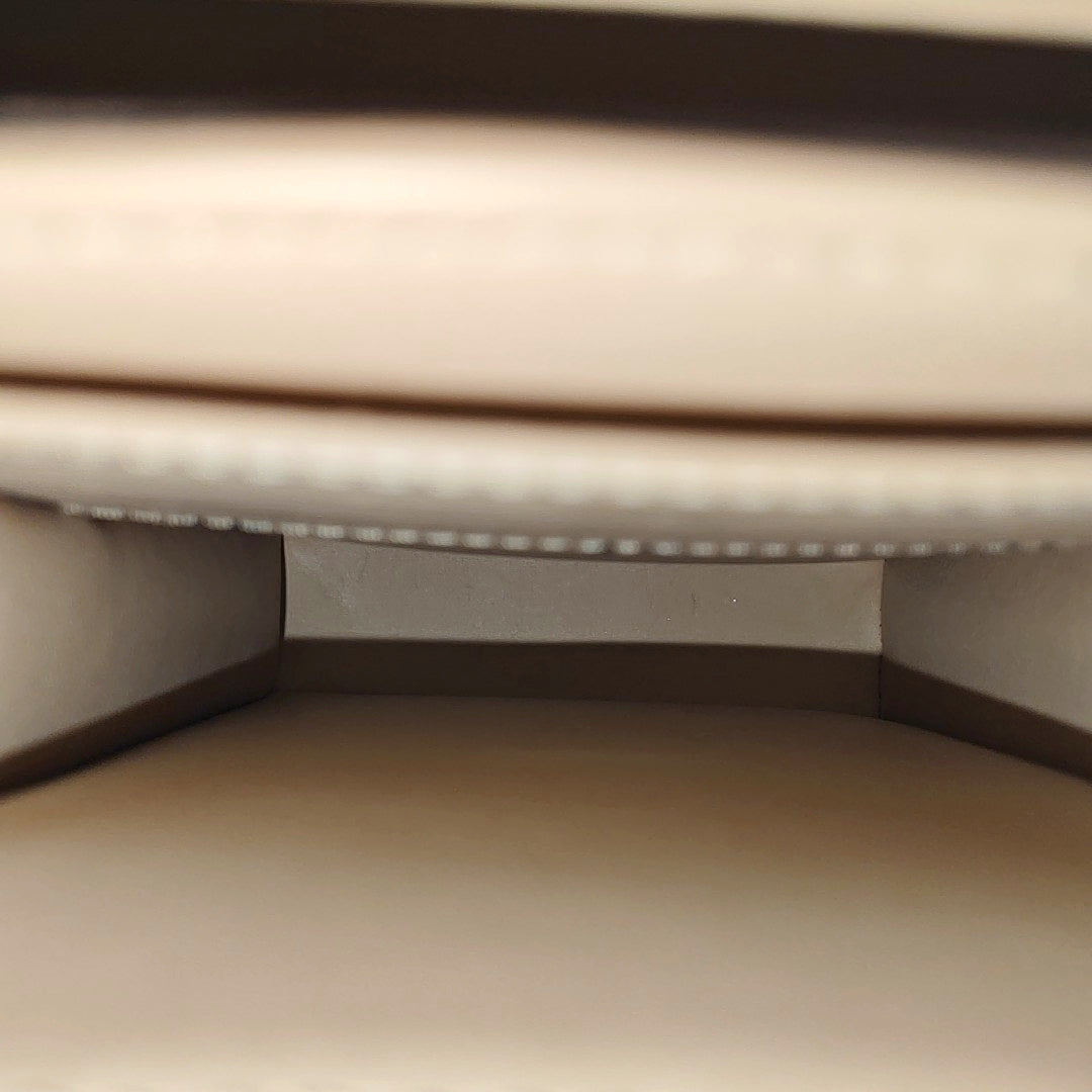 TRUNK Monogram Coated Canvas Brown