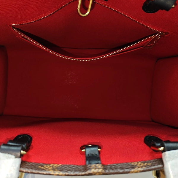 ONTHEGO MM Monogram Coated Canvas Brown