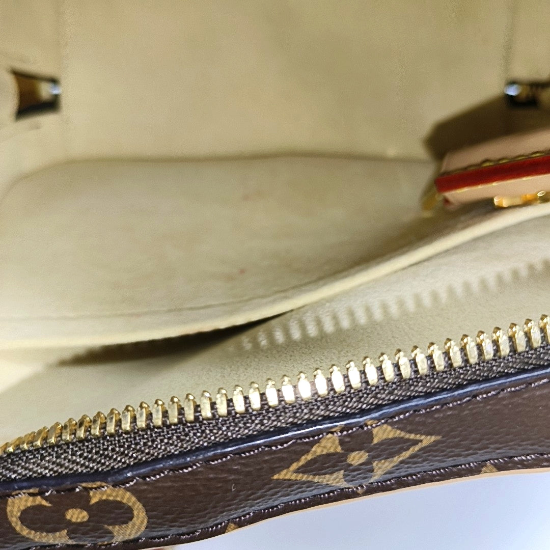LUGGAGE Monogram Coated Canvas Brown