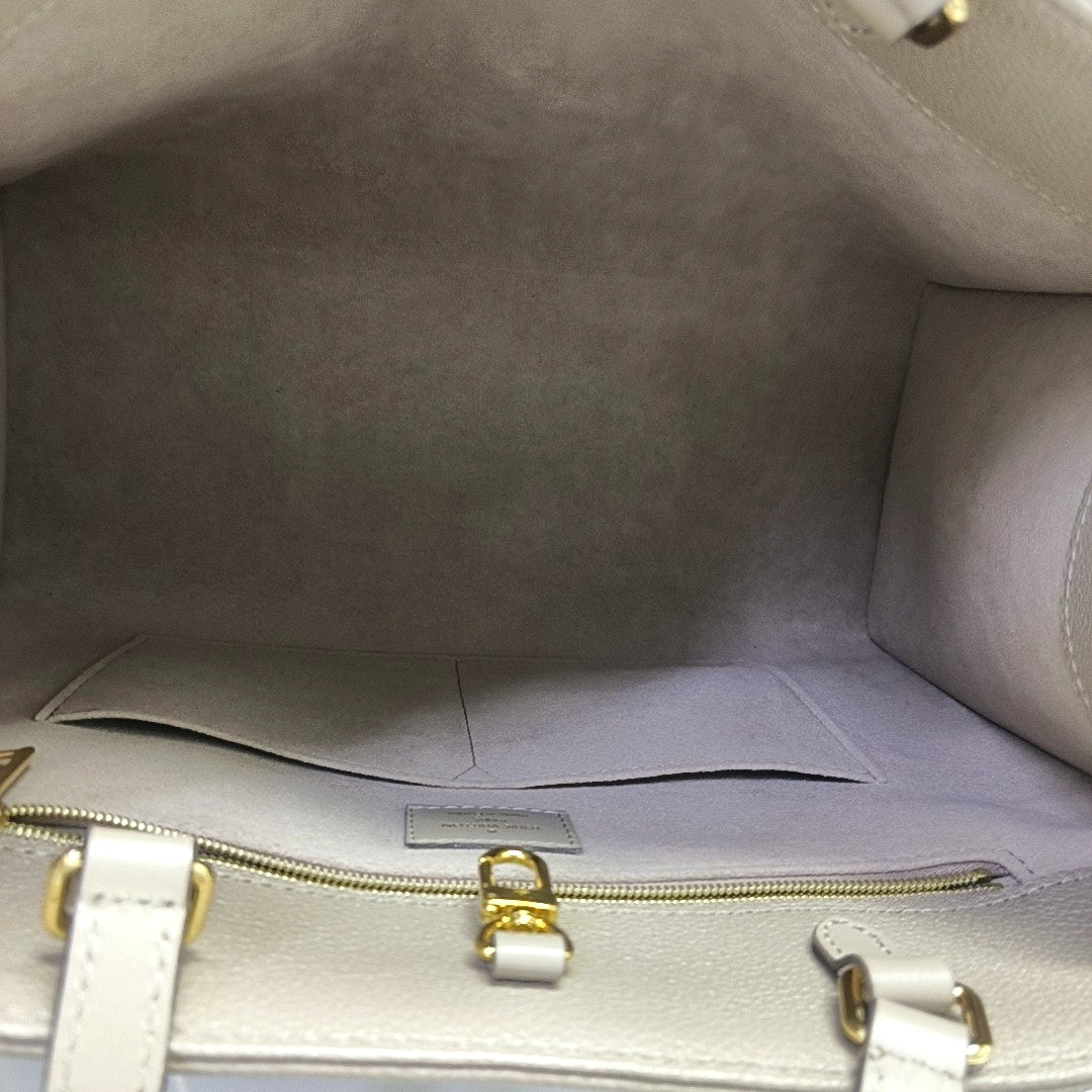 Authenticated pre-owned  ONTHEGO MM Monogram Calfskin Grey - Tote Bag at Looply