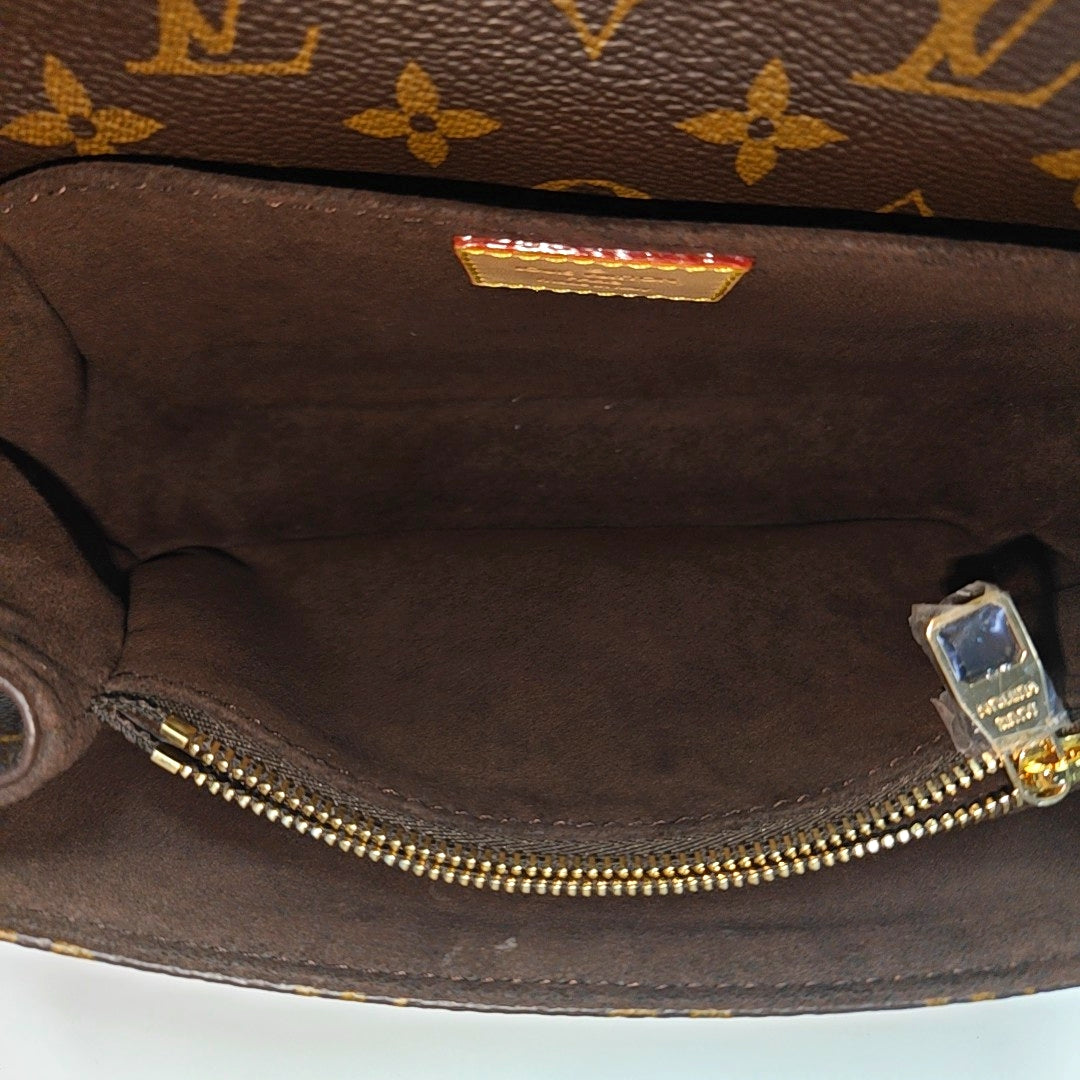 MÉTIS EAST WEST Monogram Coated Canvas Brown