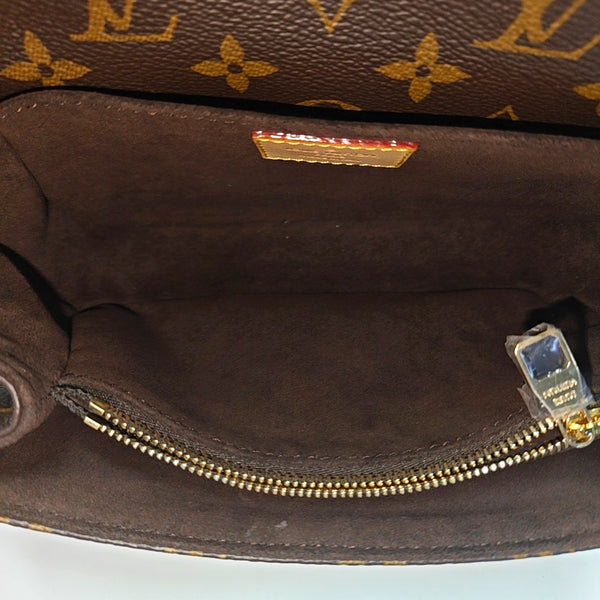 MÉTIS EAST WEST Monogram Coated Canvas Brown