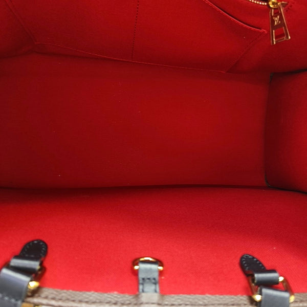 ONTHEGO GM Monogram Coated Canvas Brown