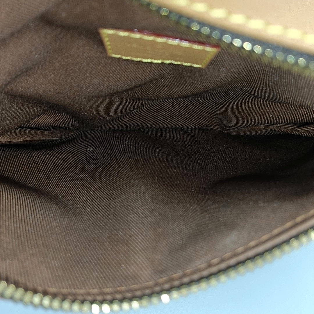 SAUMUR PM Monogram Coated Canvas Brown