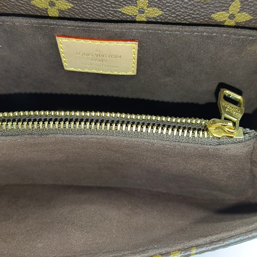 MÉTIS EAST WEST Monogram Coated Canvas Brown