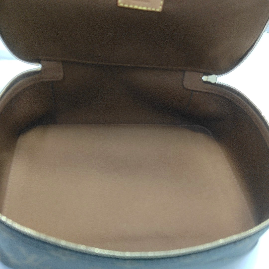 Monogram Coated Canvas Clutch Brown