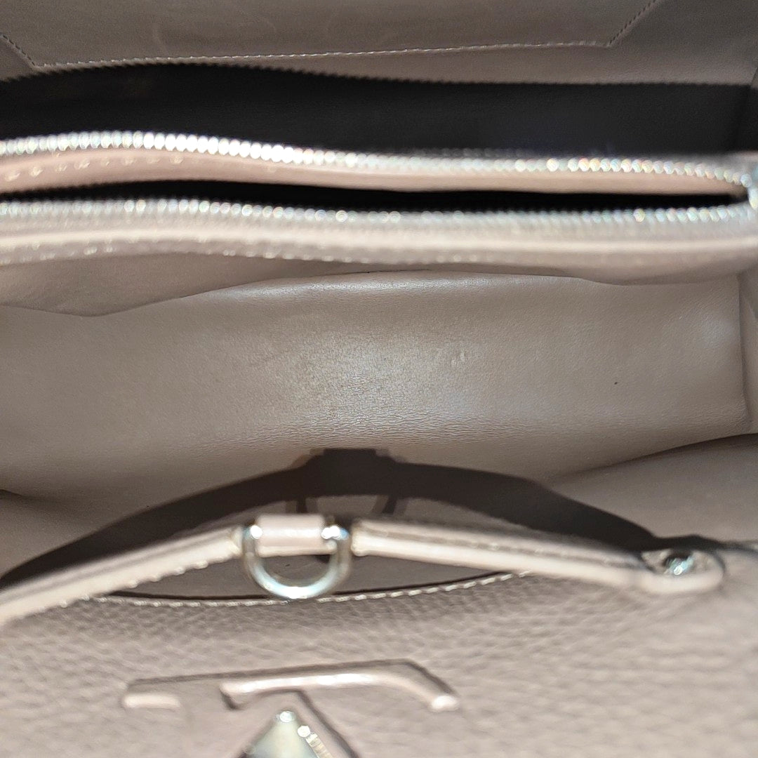 Authenticated pre-owned  CAPUCINES GM Calfskin Pink - Top Handle Bag at Looply