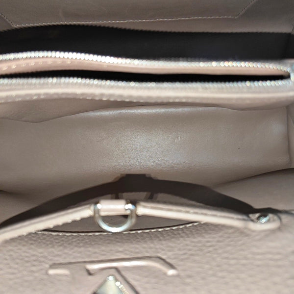 Authenticated pre-owned  CAPUCINES GM Calfskin Pink - Top Handle Bag at Looply
